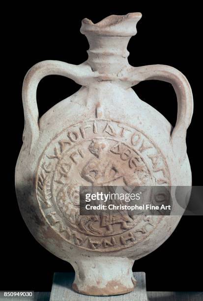 Christian Antiquity. Eulogy Ampulla depicting The Martyrdom of St. Thecla. Terracota. 6Th century AD. Paris Louvre Museum.