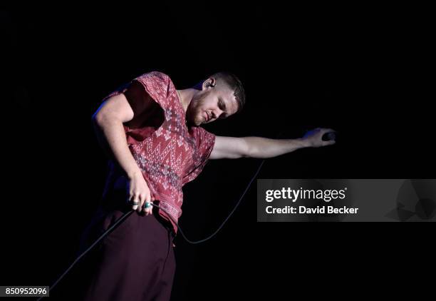 Frontman Dan Reynolds of Imagine Dragons performs after the band, joined by VH1 Save The Music Foundation, Life is Beautiful and Toyota, presented...