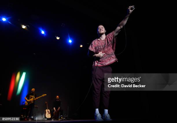 Bassist Ben McKee, drummer Daniel Platzman and frontman Dan Reynolds of Imagine Dragons perform after the band, joined by VH1 Save The Music...