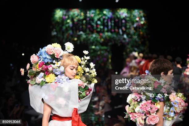 Models walk the runway at the Moschino Spring Summer 2018 fashion show during Milan Fashion Week on September 21, 2017 in Milan, Italy.