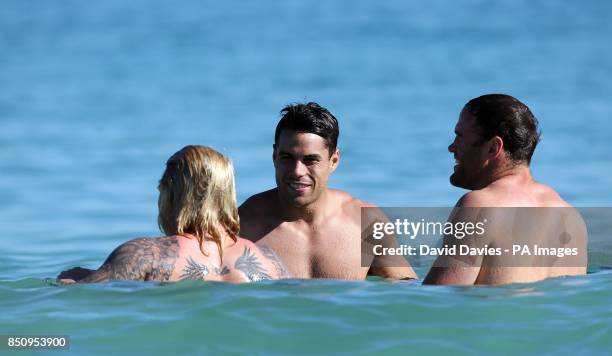 British and Irish Lions' Richard Hibbard, Sean Maitland and Jamie Roberts during a recovery session at City Beach, Perth in Australia.