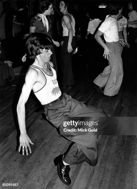 Dancers showing off the characteristic fashions and energetic dance moves of Northern Soul on the dance floor at an 'all-dayer', at The Palais,...