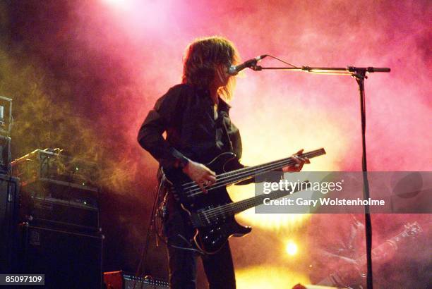 Photo of Boris WILLIAMS, Takeshi performing on stage, twin necked bass guitar