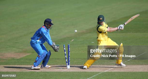 Australia' batsman Adam Voges is bowled for the final wicket of the game by India bowler Ravichandran Ashwin watched by India wicketkeeper and...