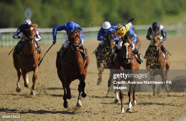 Bedouin Invader ridden by jockey Ryan Moore comes home ahead of Thouwra riddeb ny Mikael Barzalona to win the Follow Us On Twitter @lingfield Park...