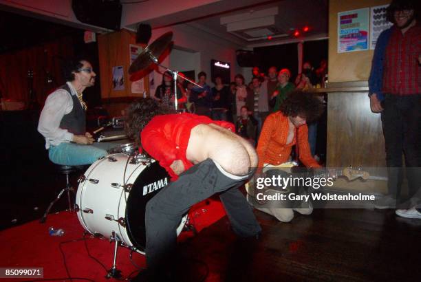 Photo of MONOTONIX and Yonatan GAT and Ami SHALEV and GEVER, Group performing on stage L-R Gever , Ami Shalev and Yonatan Gat, mooning