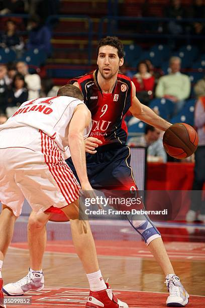 Sergi Vidal, #9 of TAU Ceramica competes with Jobey Thomas, #11 of AJ Milano during the Euroleague Basketball Last 16 Game 4 match between Armani...