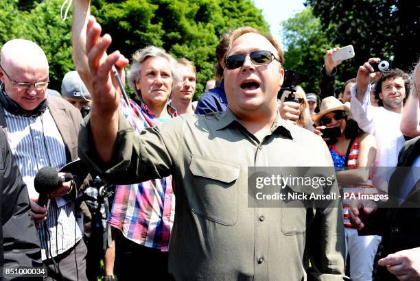 American radio host, author, conspiracy theorist and documentary filmmaker Alex Jones, speaks to the media outside the Grove Hotel, in Watford where...