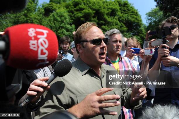 American radio host, author, conspiracy theorist and documentary filmmaker Alex Jones, speaks to the media outside the Grove Hotel, in Watford where...