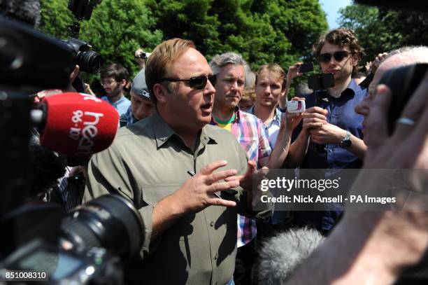 American radio host, author, conspiracy theorist and documentary filmmaker Alex Jones, speaks to the media and his followers as he arrives at the...