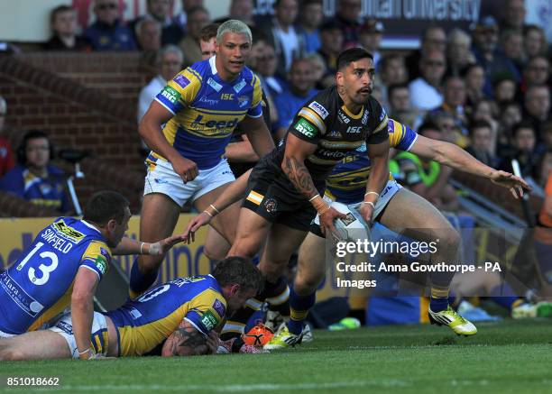 Castleford Tigers' Rangi Chase looks to pass the ball under pressure from the Leeds Rhinos' defence during the Super League match at Headingley...