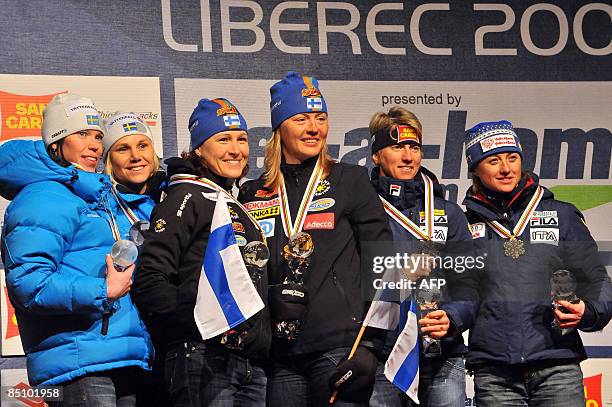 Lina Andersson and Anna Olsson of Sweden, Virpi Kuitunen and Aino Kaisa Saarinen of Finland and Marianna Longa and Arianna Follis of Italy celebrate...