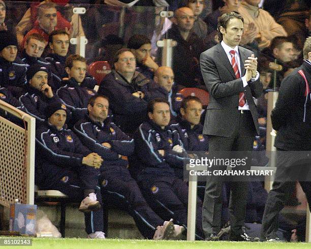 Gianfranco Zola , manager of West Ham Gareth Southgate , manager of Middlesbrough, watch a 2-0 victory for 'Boro' in an English FA Cup, fifth round...