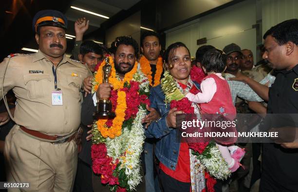 "Slumdog Millionaire" Indian sound engineer, Resul Pookutty along with his wife and son and actor Irfan Khan , is escorted by the police and security...