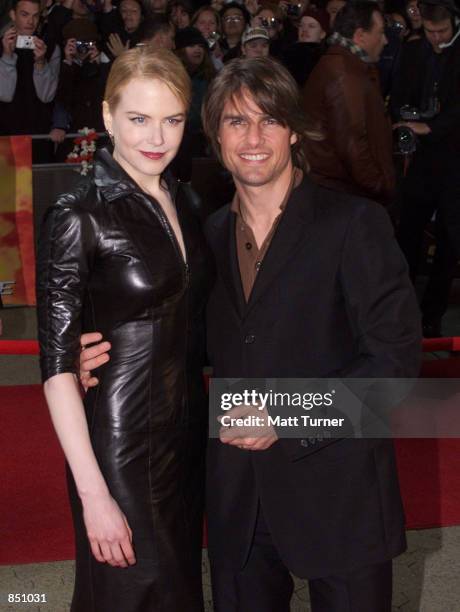 Actor Tom Cruise and his wife Nicole Kidman pose for photographers at the Sydney premiere of "Mission Impossible 2" May 30, 2000 at Fox Studios in...