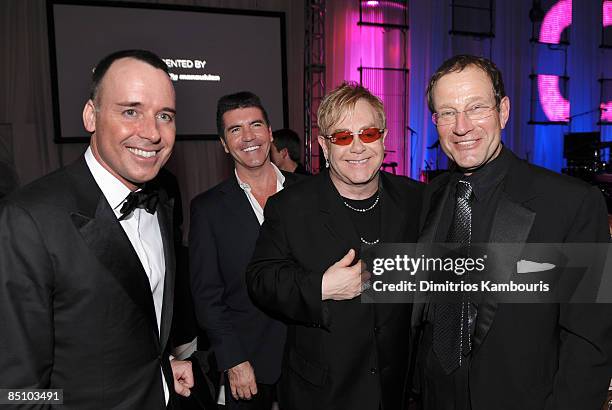 Filmmaker David Furnish, Simon Cowell, Sir Elton John and Richard Desmond, owner of OK! Magazine attend the 17th Annual Elton John AIDS Foundation...