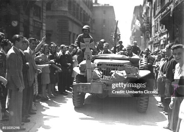 June 4, 1944. Rome, Italy, American soldiers driving down Via del Corso.