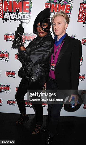 Philip Treacy and Grace Jones pose in the winners room during the Shockwaves NME Awards 2009, at the O2 Brixton Academy on February 25, 2009 in...