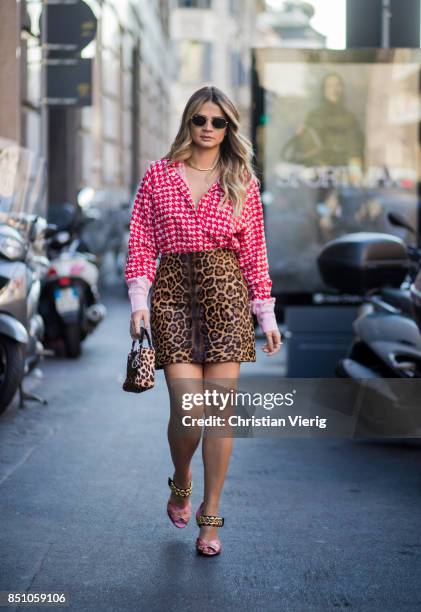 Thassia Naves wearing skirt with leo print, blouse, Dior bag with leo print is seen outside Max Mara during Milan Fashion Week Spring/Summer 2018 on...