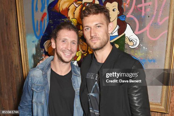 Robyn Ward and Alex Pettyfer attend a private view of new exhibition "A Simpler Time " by artist Robyn Ward at the Old Chappell Piano Factory on...