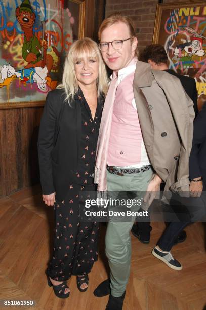 Jo Wood and Henry Conway attend a private view of new exhibition "A Simpler Time " by artist Robyn Ward at the Old Chappell Piano Factory on...