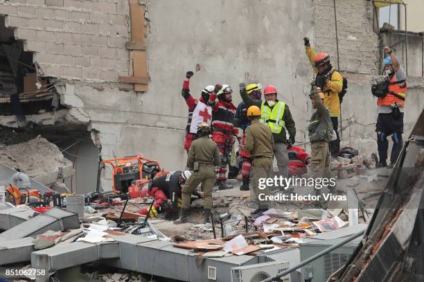 Rescuers and volunteers work in a building that collapsed two days after the magnitude 7.1 earthquake jolted central Mexico killing more than 250...