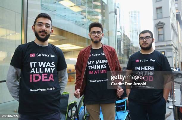 Mazzen Kaourouche, Abdal Salem and Rami Dan Daci, who had been queueing for eleven days, pose at the front of the queue at the Apple Store on...