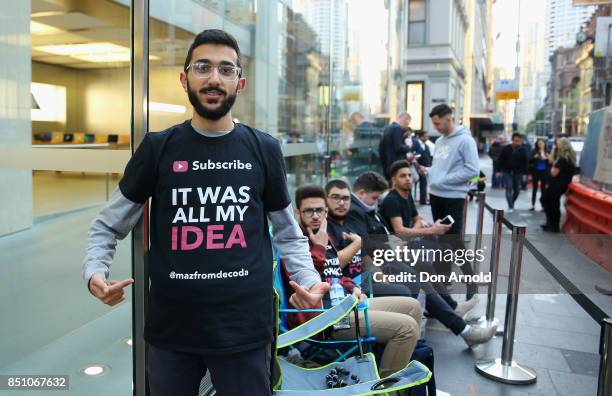 Mazzen Kaourouche, who had been queueing for eleven days with his two friends, poses outside before being allowed inside for the release of the...