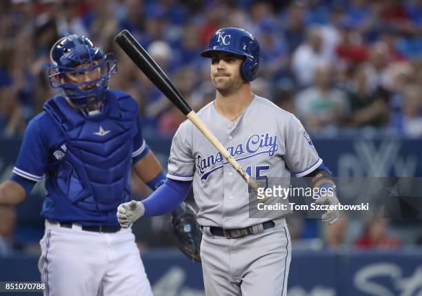 Whit Merrifield of the Kansas City Royals reacts after striking out in the first inning during MLB game action against the Toronto Blue Jays at...