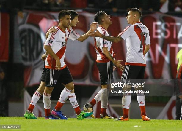 Enzo Perez of River Plate and teammates celebrate their team's fourth goal during a second leg match between River Plate and Wilstermann as part of...