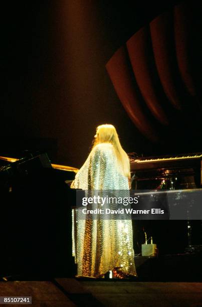 Photo of YES and Rick WAKEMAN, Rick Wakeman performing on stage, cape
