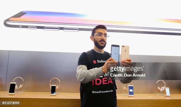 Mazzen Kaourouche, who had been queueing for eleven days with his two friends, displays the iPhone 8 and 8 Plus at Apple Store on September 22, 2017...