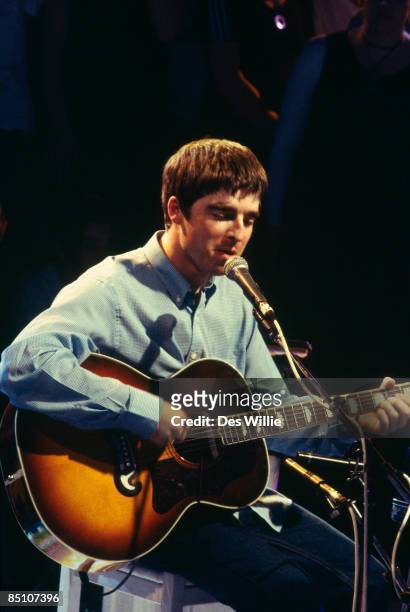 Photo of OASIS and Noel GALLAGHER, Noel Gallagher performing on tv show, acoustic guitar