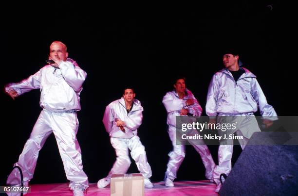 Photo of 98 DEGREES and 98o and Justin JEFFRE and Drew LACHEY and Jeff TIMMONS and Nick LACHEY, Group performing on stage L-R Justin Jeffre, Drew...