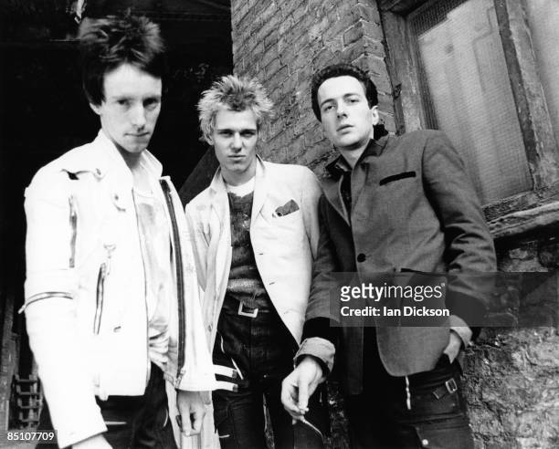 Photo of CLASH and Topper HEADON and Paul SIMONON and Joe STRUMMER; Posed group portrait L-R Topper Headon, Paul Simonon and Joe Strummer