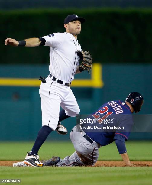 Second baseman Ian Kinsler of the Detroit Tigers avoids Jason Castro of the Minnesota Twins after turning the ball for a double play on Brian Dozier...