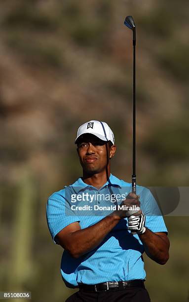 Tiger Woods tees off on the 16th hole en route to a 3 & 2 victory over Brendan Jones during the first round of the Accenture Match Play Championships...