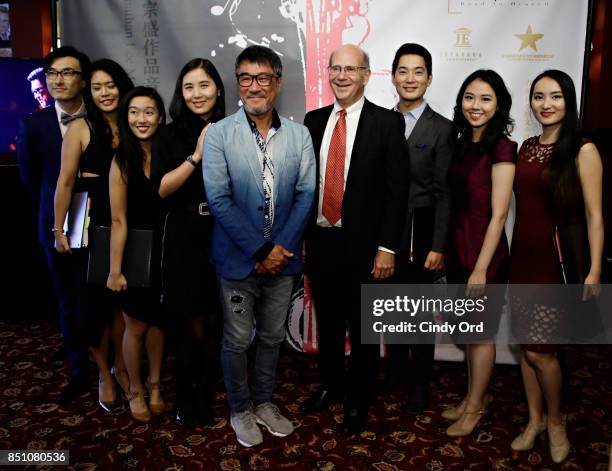 Ivy Zhong, Jonathan Lee and Don Frantz pose with performers as Jonathan Lee and Ivy Zhong announce a new musical "Road to Heaven: The Jonathan Lee...