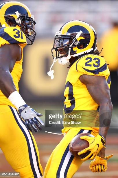 Nickell Robey-Coleman of the Los Angeles Rams celebrates his interception on the first play of the game with Maurice Alexander during their NFL game...