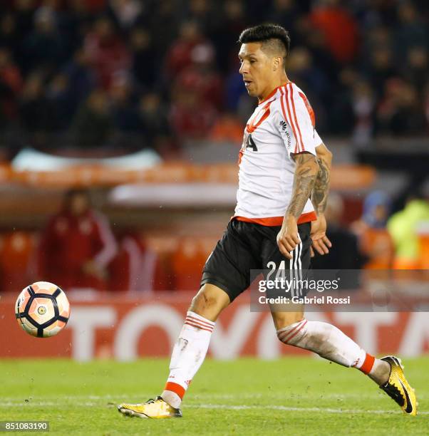 Enzo Perez of River Plate kicks the ball to score the eighth goal of his team during a second leg match between River Plate and Wilstermann as part...