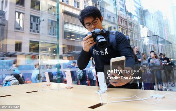 People check out product inside the store during the release of the iPhone 8 and 8 Plus at Apple Store on September 22, 2017 in Sydney, Australia....