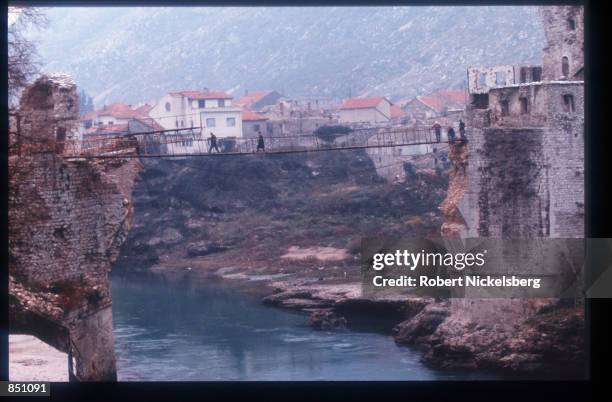 Bridge destroyed by the Croatian army is being rebuilt with Turkish funds December 15, 1994 in Mostar, Bosnia-Herzegovina. Civil war erupted in...