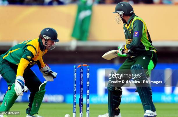 Pakistan's Shoaib Malik is bowled by JP Duminy during the ICC Champions Trophy match at Edgbaston, Birmingham.