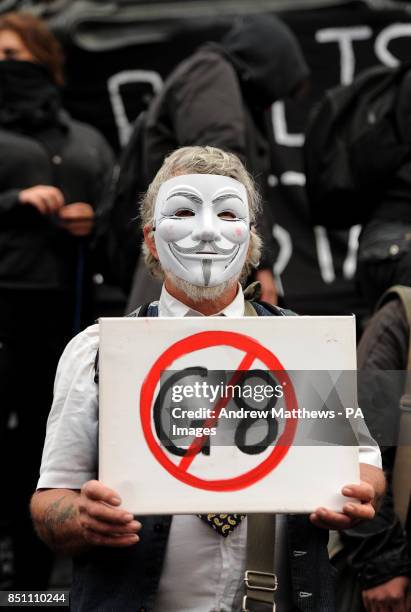 Anti G8 protesters sit around the statue of Eros in Piccadilly Circus, London.