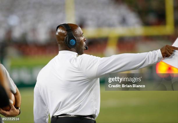 Head coach Charlie Strong of the South Florida Bulls gestures from the sidelines during the second quarter of an NCAA football game against the...