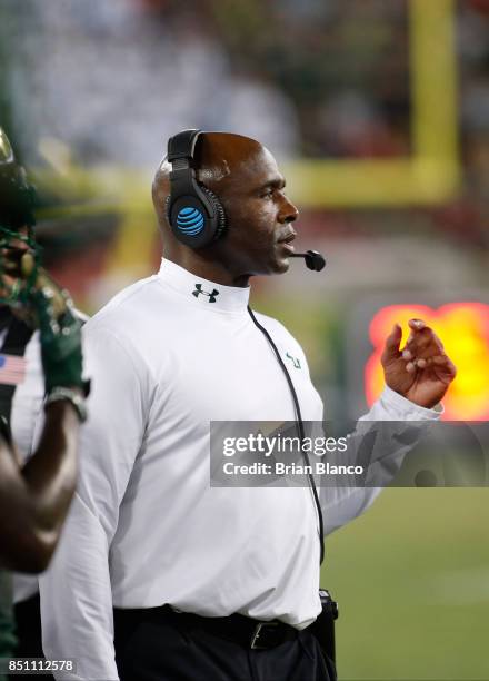 Head coach Charlie Strong of the South Florida Bulls looks on from the sidelines during the second quarter of an NCAA football game against the...