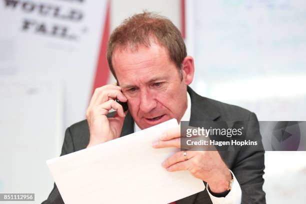 Former Labour leader Andrew Little makes a campaing call during a visit to Rongotai candidate Paul Eagle's phone bank on September 21, 2017 in...