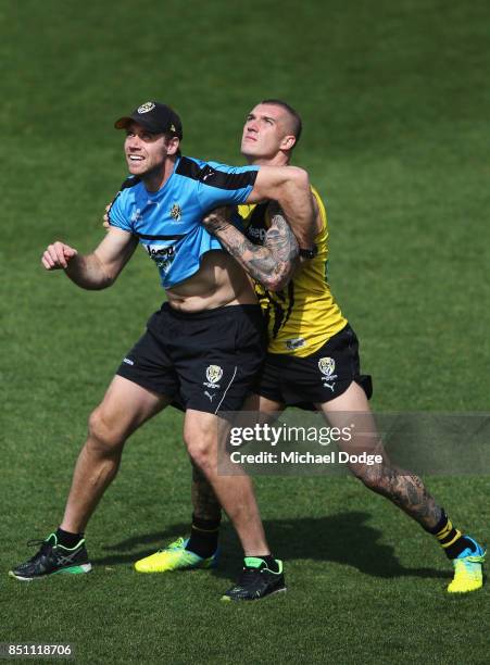 Dustin Martin of the Tigers and assistant coach Ben Rutten during a Richmond Tigers AFL training session at Punt Road Oval on September 22, 2017 in...