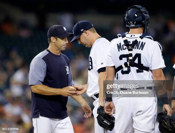 Manager Brad Ausmus of the Detroit Tigers takes the ball from Warwick Saupold of the Detroit Tigers during the fifth inning of a game against the...