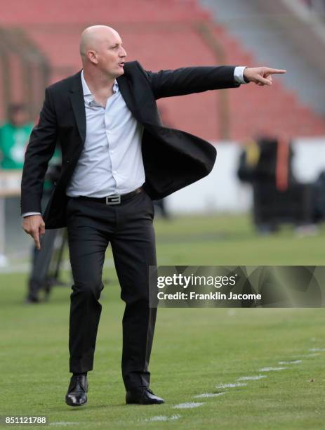 Pablo Repetto, coach of LDU Quito, gives instructions to his players during a second leg match between LDU Quito and Fluminense as part of round of...